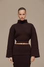 Lincoln Paris Winter Affair Set featuring cozy knit sweaters and scarves in neutral tones, perfect for cold weather.