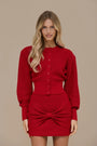 Crimson Doll Set by Lincoln Paris featuring elegant red dolls with detailed clothing and accessories.