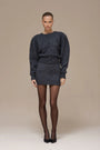 Lincoln Paris Winter Noir Set featuring a stylish dark winter coat and matching accessories, displayed on a mannequin.