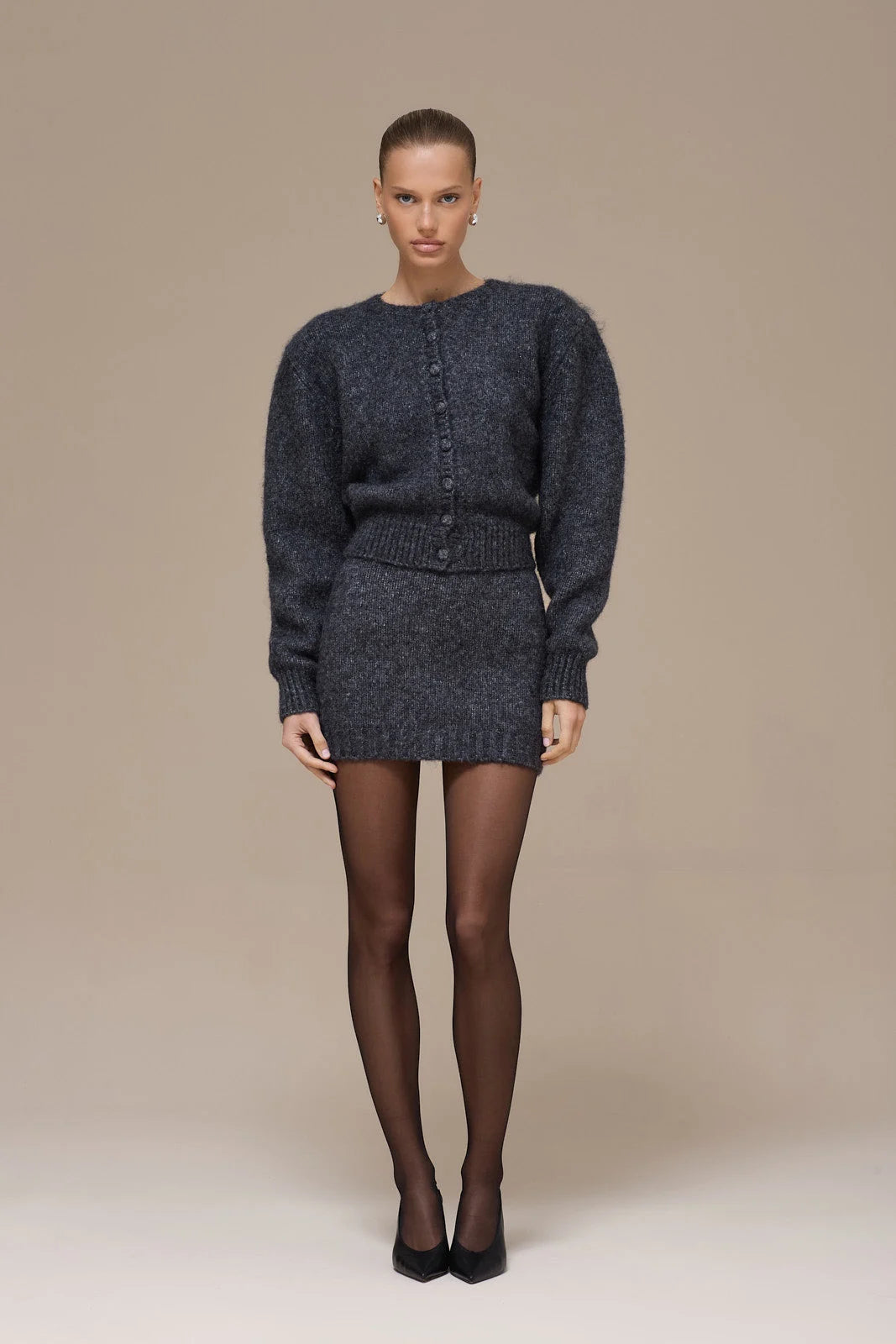 Lincoln Paris Winter Noir Set featuring a stylish dark winter coat and matching accessories, displayed on a mannequin.