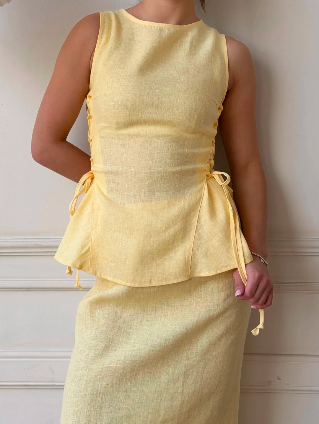Lincoln Paris Buttercup Co-ord set featuring a stylish matching crop top and high-waisted skirt in soft buttercup yellow.
