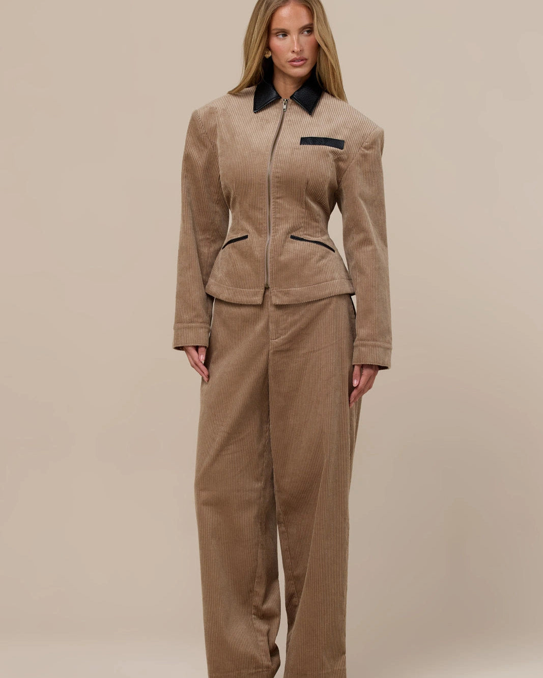 Taupe cord co-ord set from Lincoln Paris featuring a matching top and pants, styled casually on a model.
