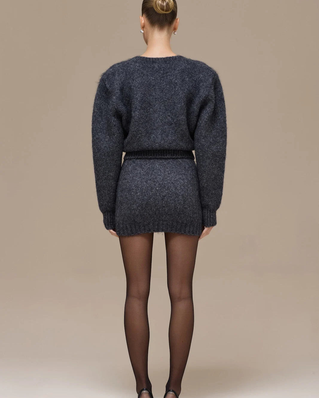 Lincoln Paris Winter Noir Set featuring a stylish, dark-colored winter clothing ensemble with a coat and accessories.