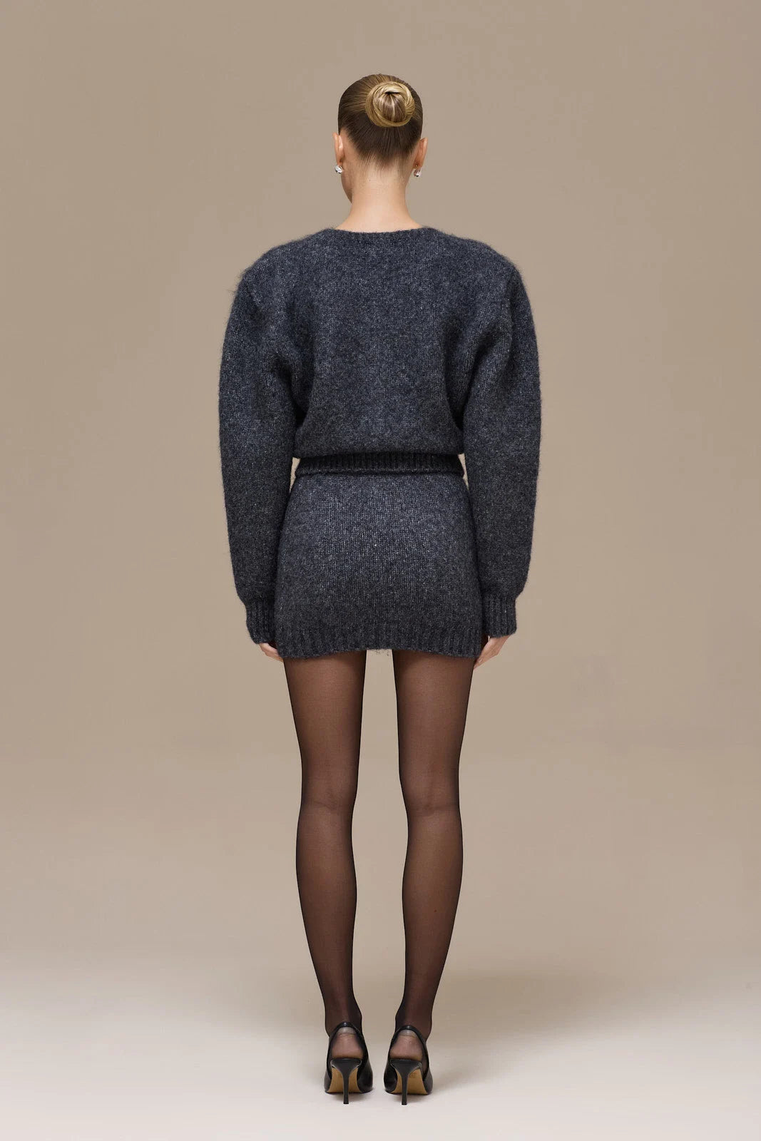Lincoln Paris Winter Noir Set featuring a stylish, dark-colored winter clothing ensemble with a coat and accessories.