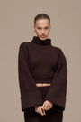 Lincoln Paris Winter Affair Set featuring cozy knit sweater and scarf in neutral tones on a mannequin.