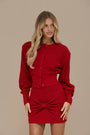 Crimson doll set by Lincoln Paris featuring multiple dolls with red outfits and detailed accessories.