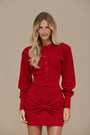 Crimson Doll Set by Lincoln Paris featuring stylish dolls with red outfits and detailed accessories on a white background.
