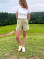 Lincoln Paris sage linen shorts displayed flat with a relaxed fit and lightweight fabric, ideal for warm weather.