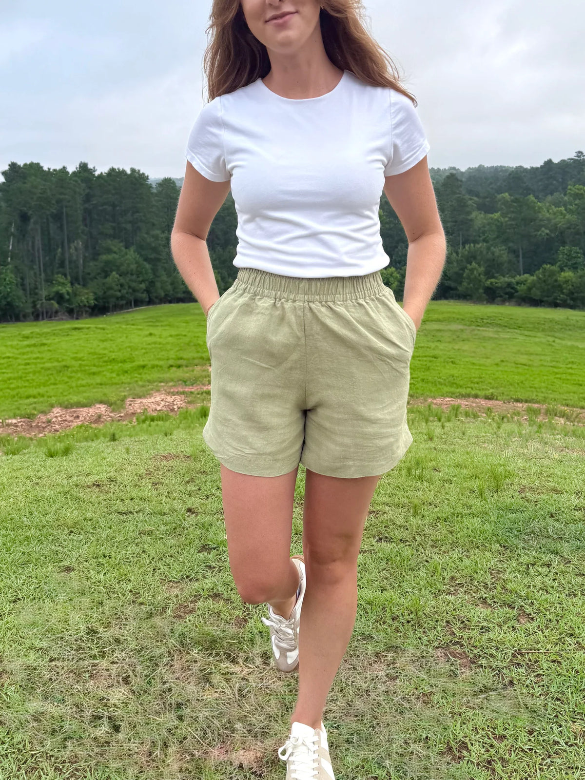 Lincoln Paris sage linen shorts laid flat showing elastic waistband and relaxed fit, perfect for casual summer wear.
