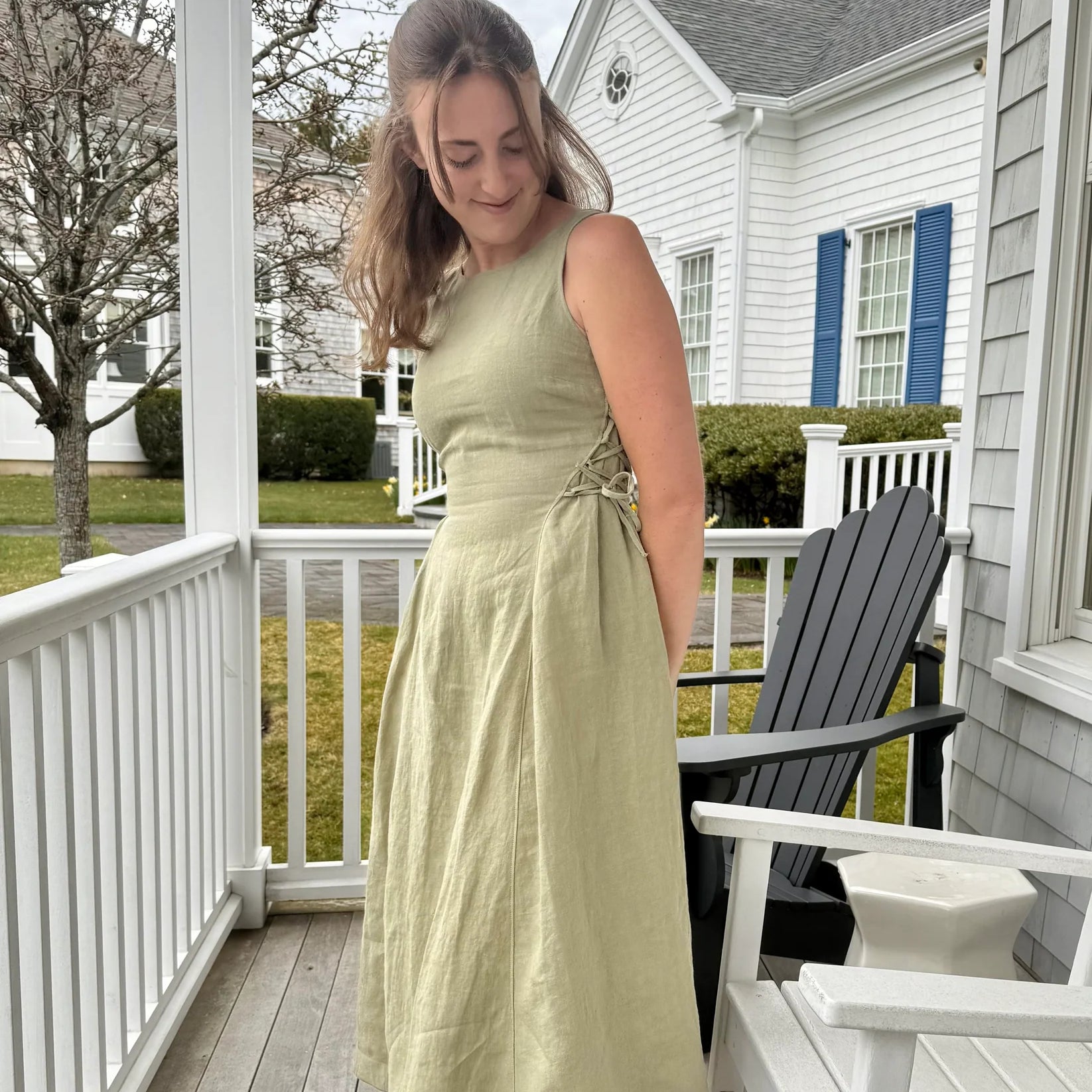 Lincoln Paris Sage linen dress displayed on a hanger with a flowing, lightweight fabric, ideal for casual and summer wear.