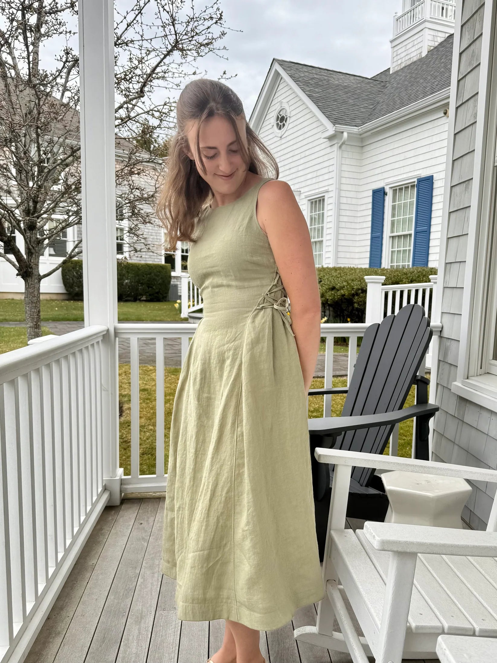 Lincoln Paris Sage linen dress displayed on a hanger with a flowing, lightweight fabric, ideal for casual and summer wear.
