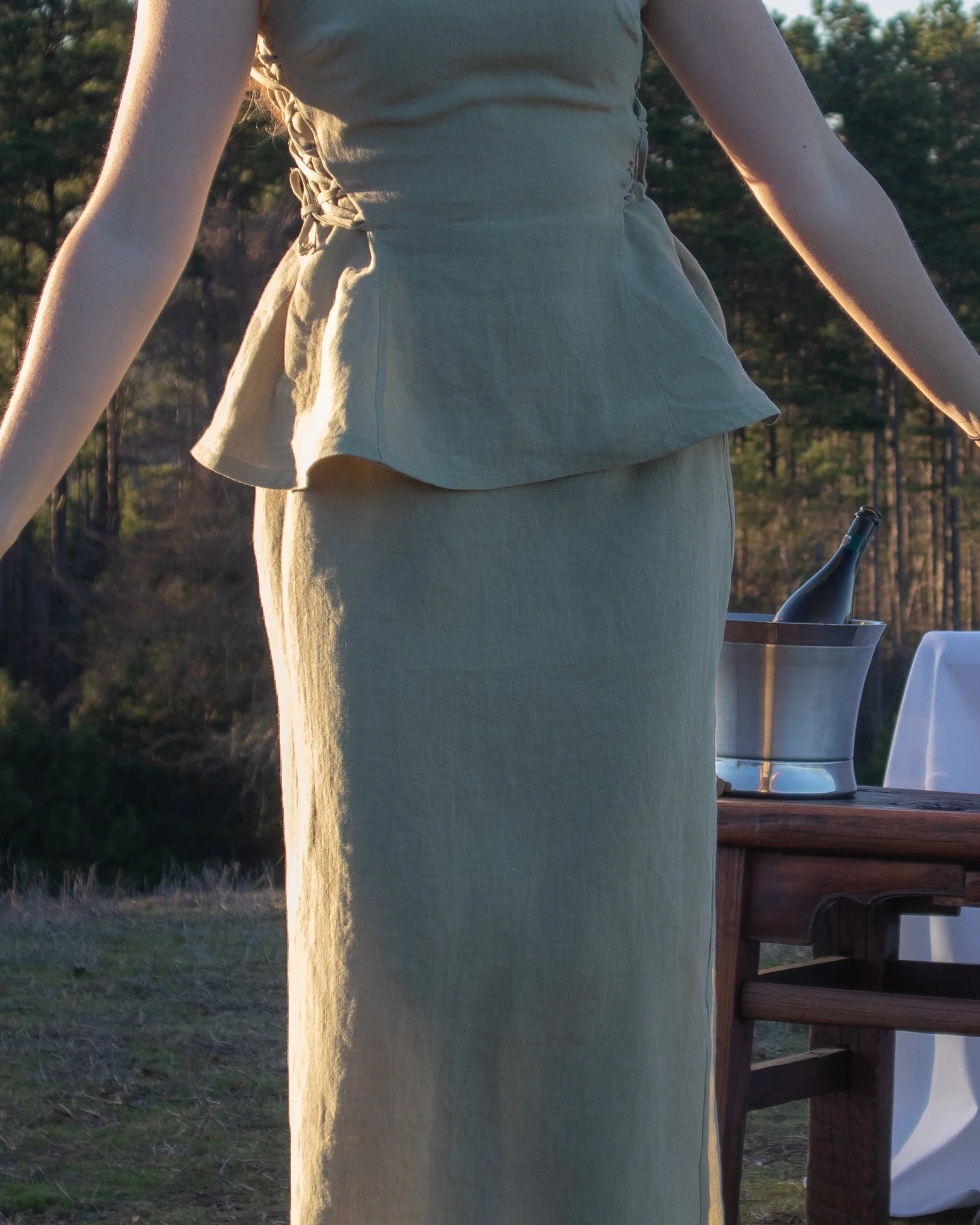 Lincoln Paris Linen Muse skirt in beige, featuring a flowy design and elastic waistband, displayed on a hanger.