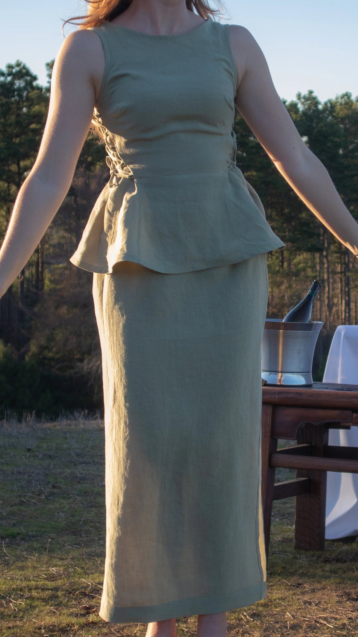 Lincoln Paris Linen Muse skirt in beige, featuring a flowy design and elastic waistband, displayed on a hanger.