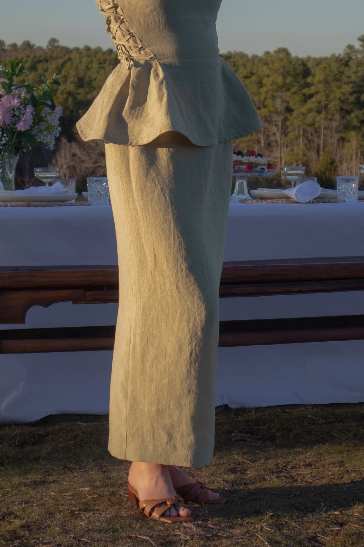 Lincoln Paris Linen Muse Skirt in natural linen fabric, featuring a flowing, midi-length design with a high waist and stylish silhouette.