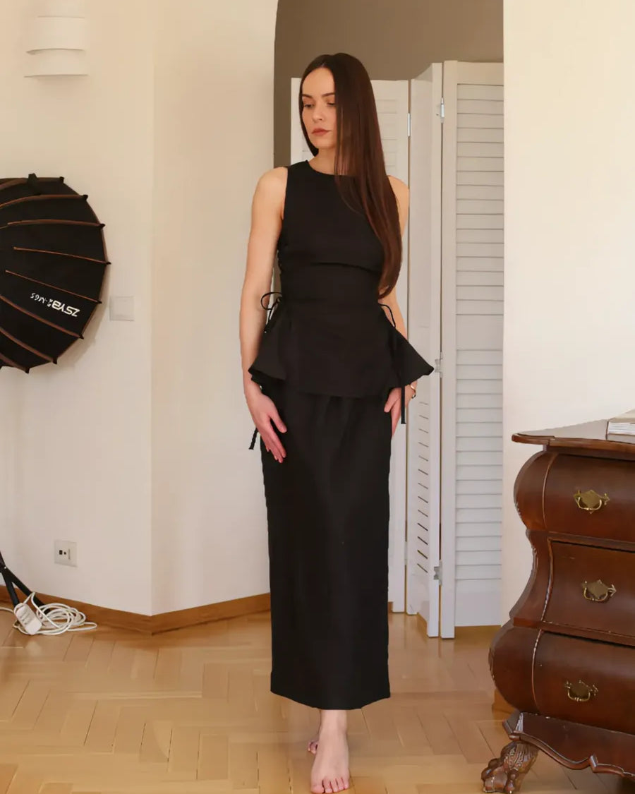 Black Swan Co-ord by Lincoln Paris featuring a stylish black matching top and pants set on a flat lay.