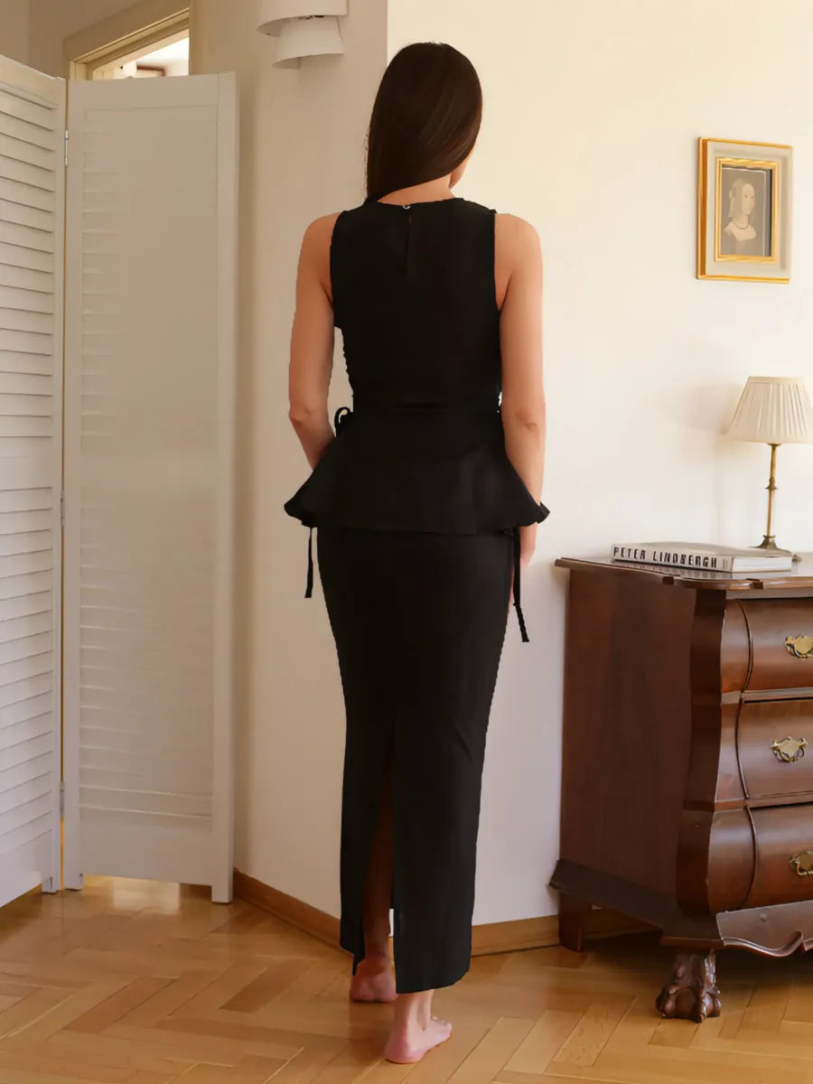Black Swan co-ord set by Lincoln Paris featuring a stylish black top and matching skirt on a model.