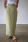 Linen Muse skirt by Lincoln Paris displayed on a model, featuring a flowing design and natural linen fabric.
