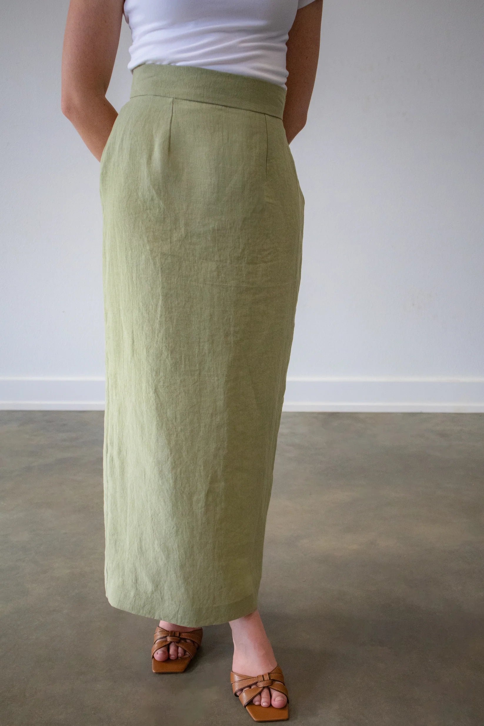 Linen Muse skirt by Lincoln Paris displayed on a model, featuring a flowing design and natural linen fabric.