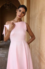 Lincoln Paris Rosewood cotton linen dress displayed on a hanger, showcasing its soft fabric and elegant design.
