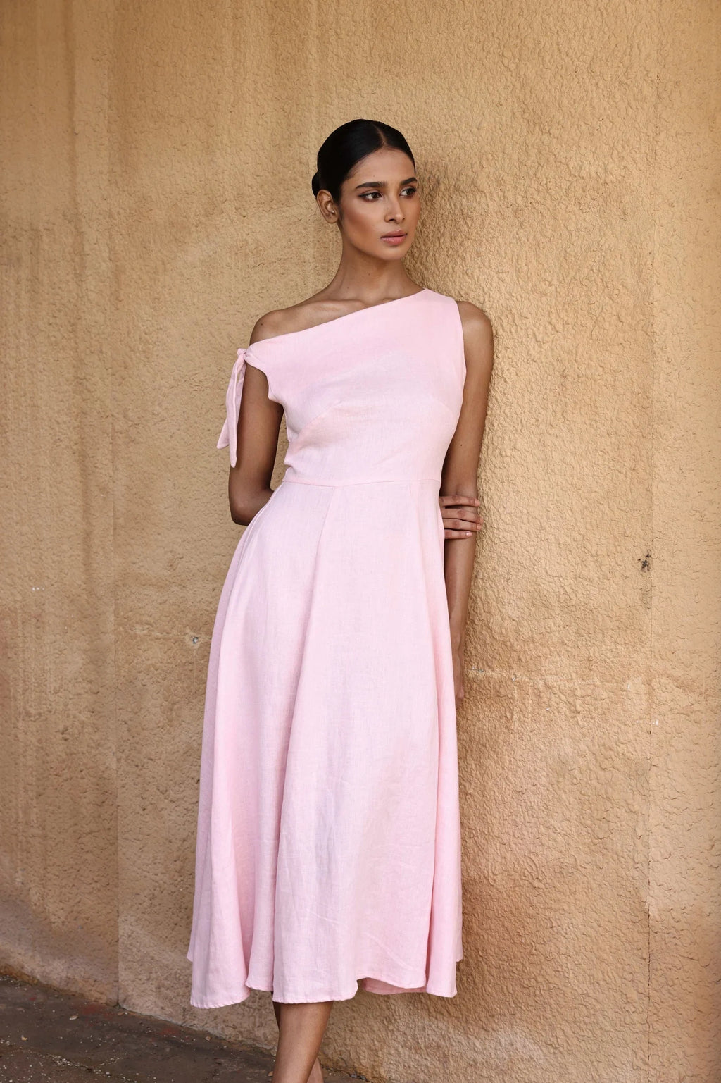 Lincoln Paris Rosewood cotton linen dress displayed on a hanger, featuring a relaxed fit and natural fabric texture.