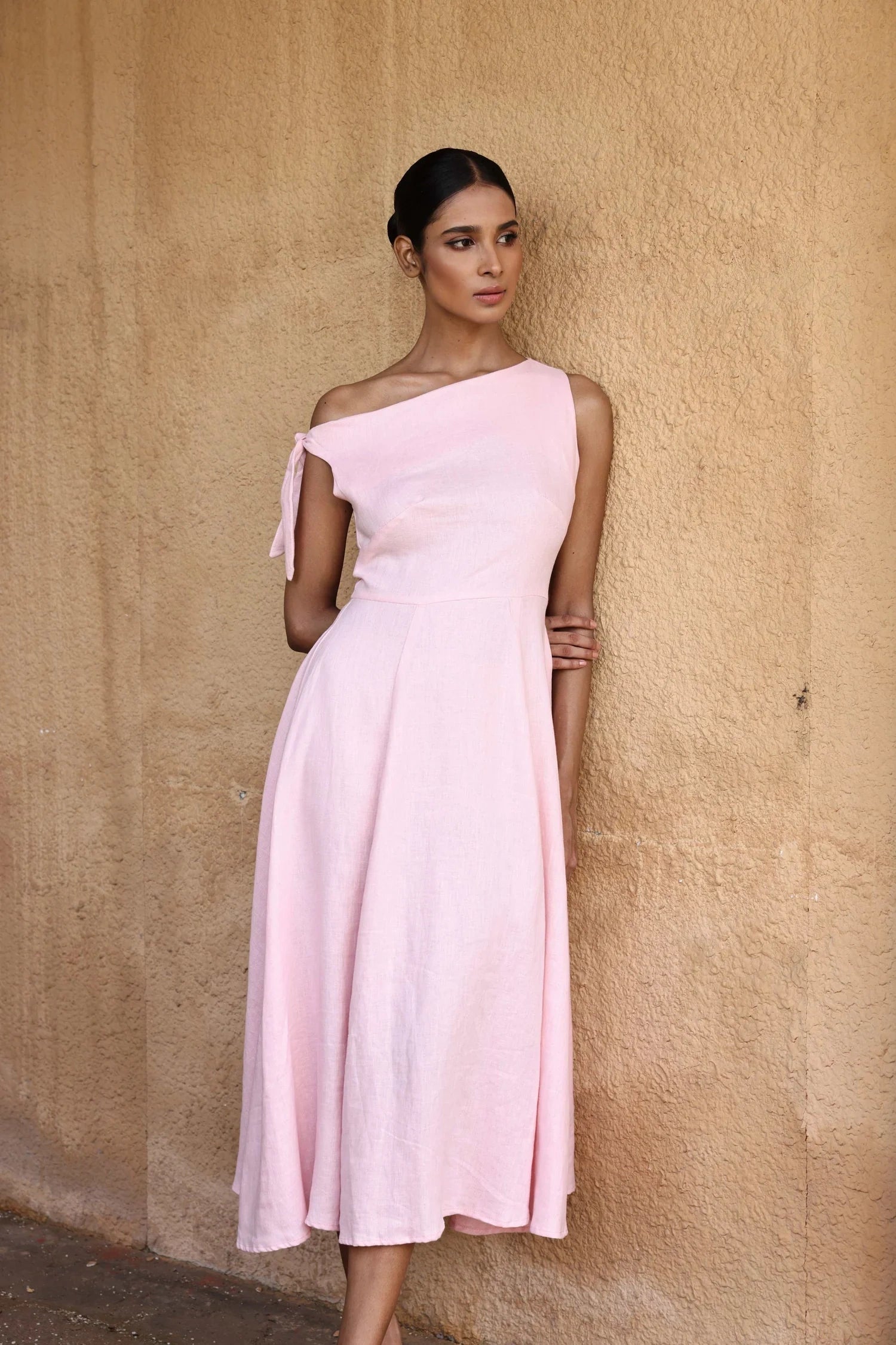 Lincoln Paris Rosewood cotton linen dress displayed on a hanger, featuring a relaxed fit and natural fabric texture.