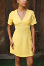 Lincoln Paris DaisyDay cotton linen dress shown on a hanger, featuring a flowy, lightweight fabric with a floral pattern.