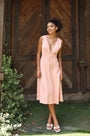 Lincoln Paris Roselle cotton linen dress displayed on a hanger, showcasing its lightweight fabric and relaxed fit.