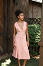 Lincoln Paris Roselle cotton linen dress displayed on a hanger, showcasing its lightweight fabric and relaxed fit.