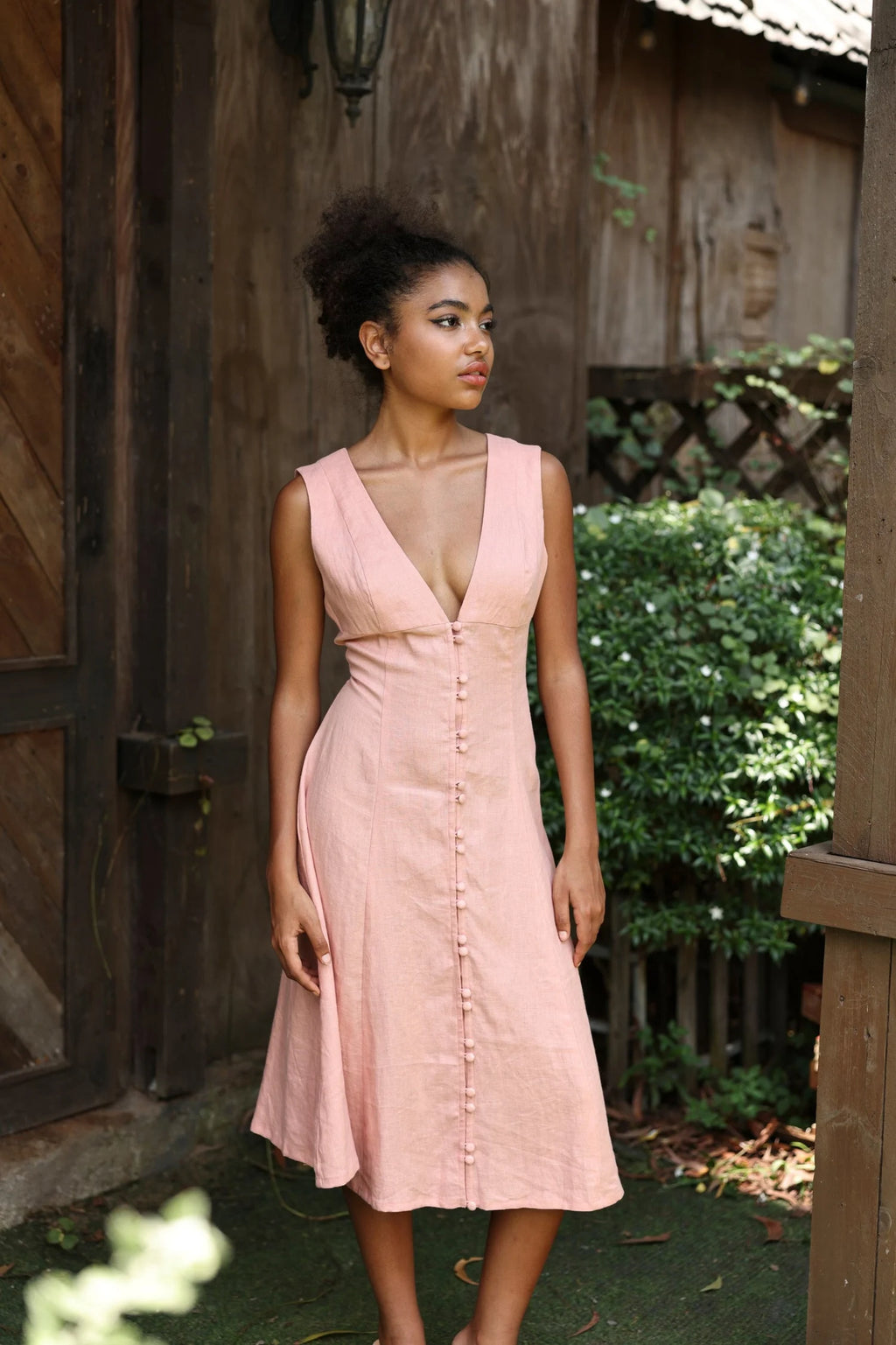 Lincoln Paris Roselle cotton linen dress displayed on a hanger, showcasing its lightweight fabric and relaxed fit.