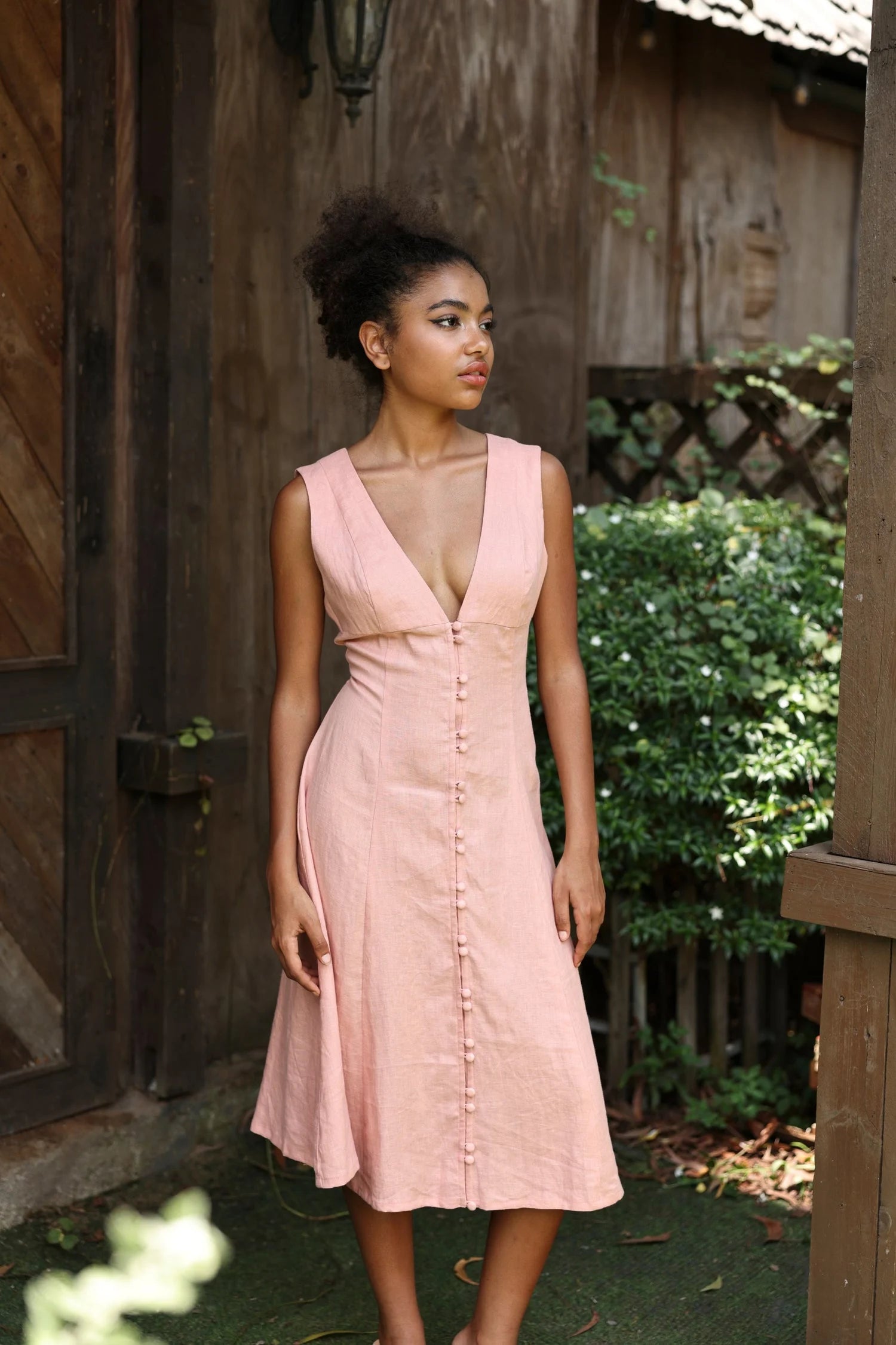 Lincoln Paris Roselle cotton linen dress displayed on a hanger, showcasing its lightweight fabric and relaxed fit.
