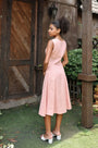 Lincoln Paris Roselle cotton linen dress displayed on a hanger with a flowing, lightweight design and natural fabric texture.