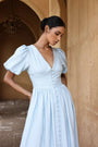 European cotton linen dress by Lincoln Paris, showing a flowy white dress with a relaxed fit and natural fabric texture.