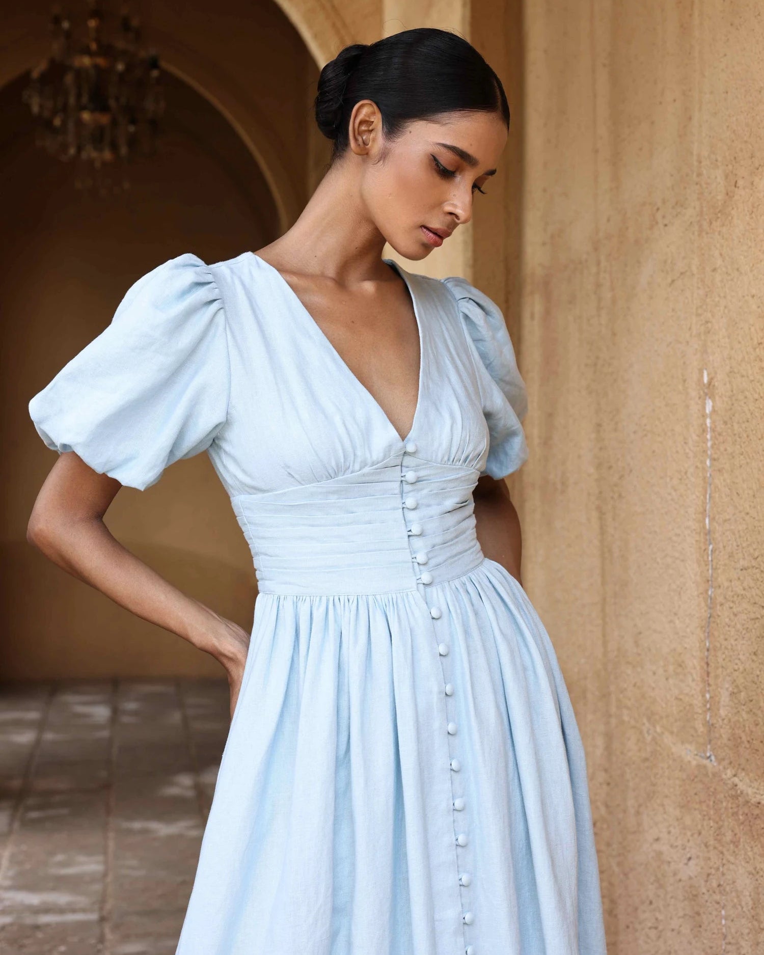 European cotton linen dress by Lincoln Paris, showing a flowy white dress with a relaxed fit and natural fabric texture.