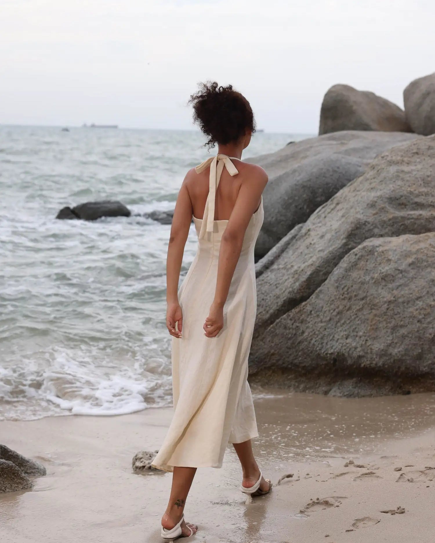 Lincoln Paris Cloud 9 Cotton Linen Dress hanging on a wooden hanger, showcasing lightweight, breathable fabric and relaxed fit.
