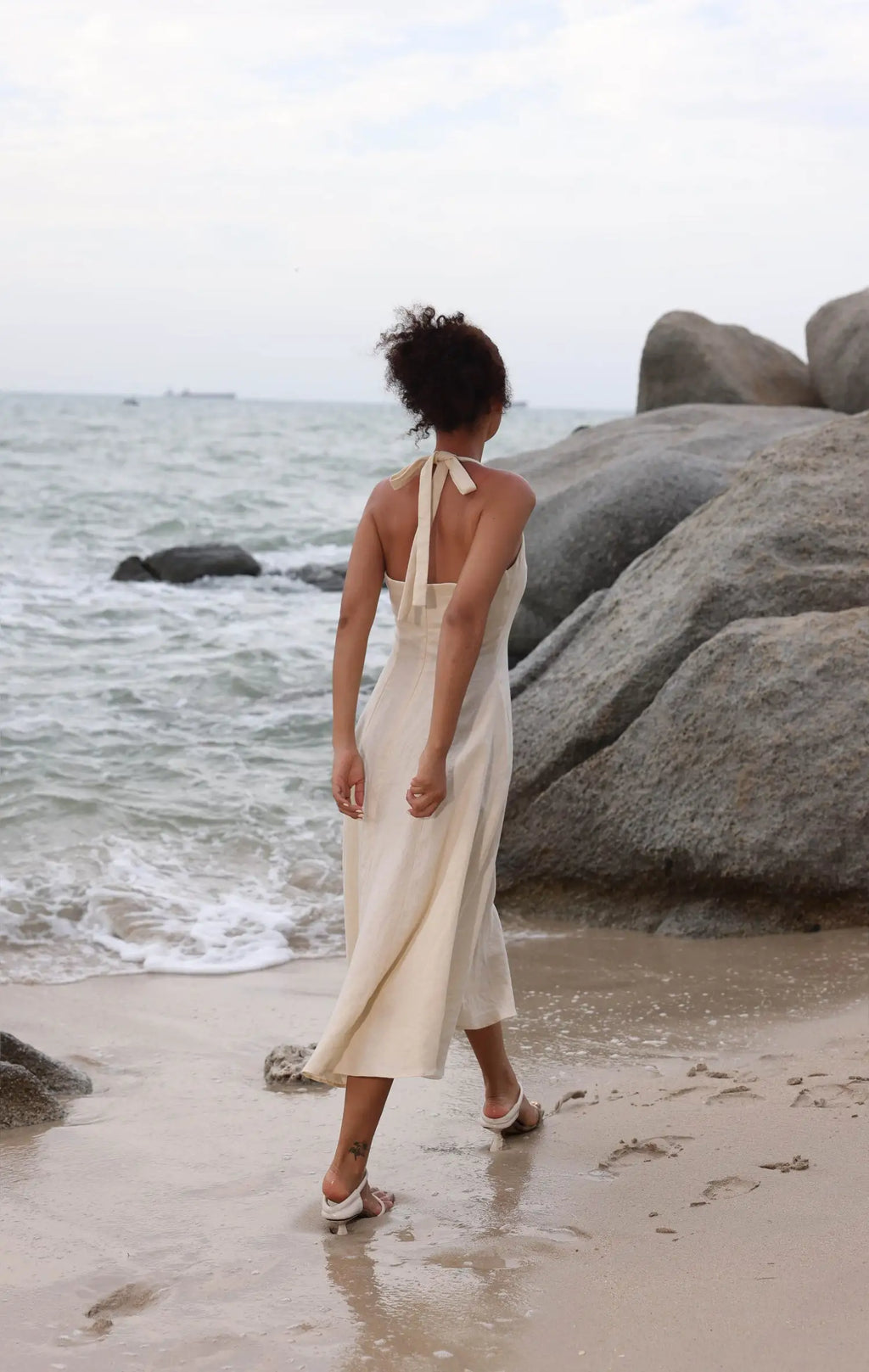 Lincoln Paris Cloud 9 Cotton Linen Dress hanging on a wooden hanger, showcasing lightweight, breathable fabric and relaxed fit.