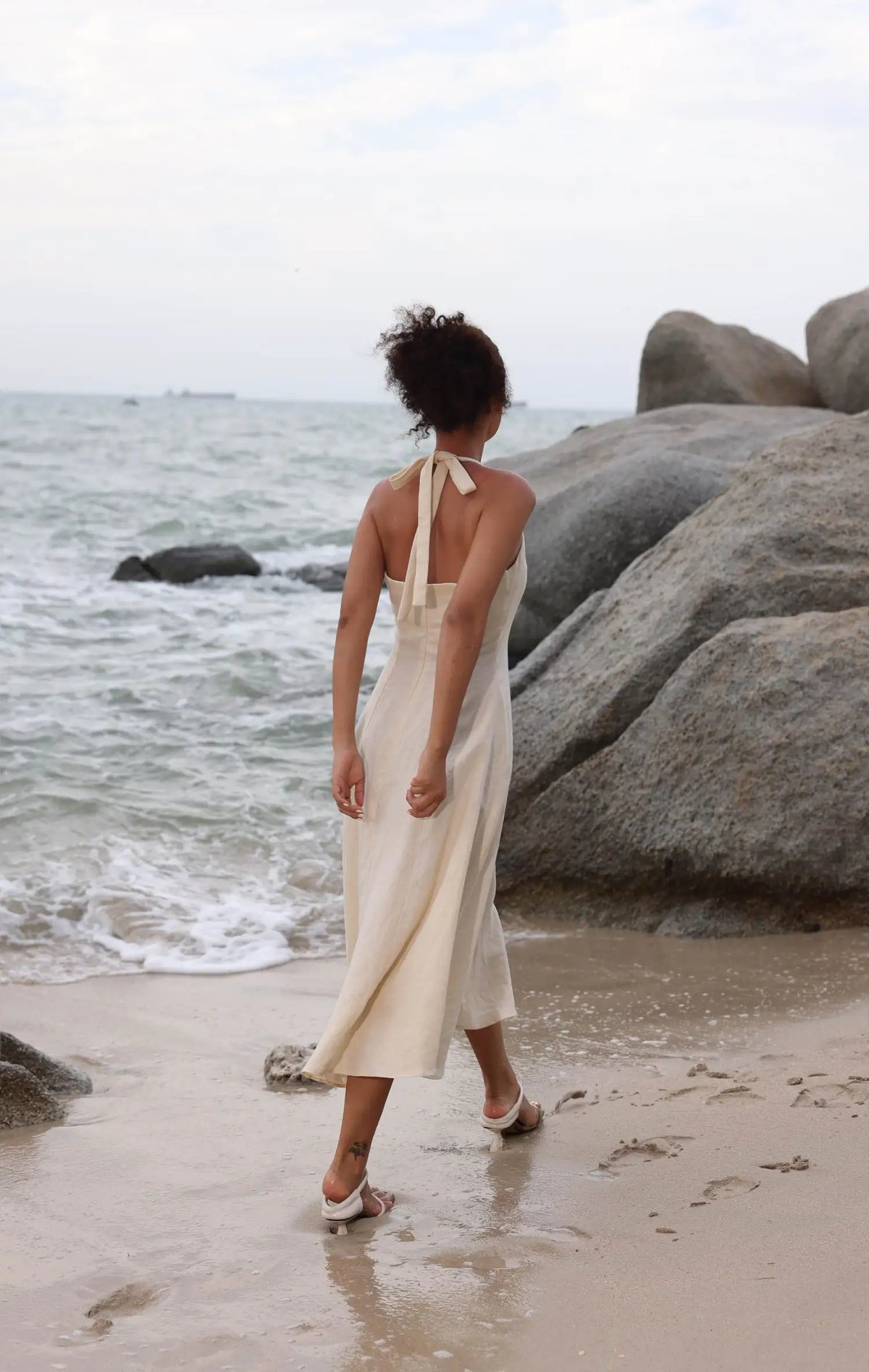 Lincoln Paris Cloud 9 Cotton Linen Dress hanging on a wooden hanger, showcasing lightweight, breathable fabric and relaxed fit.