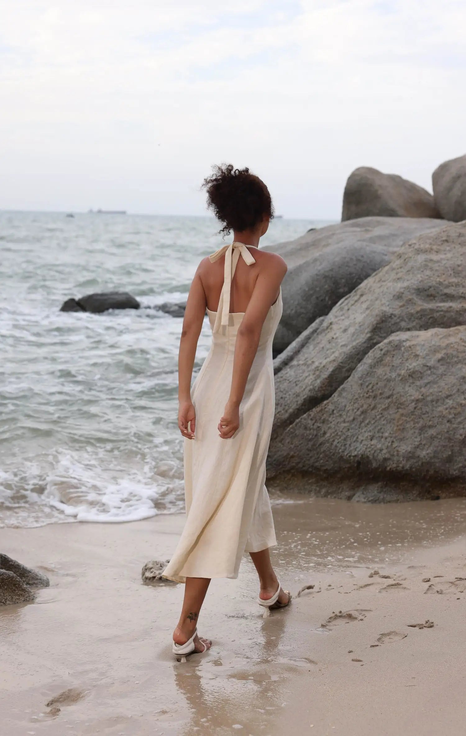 Lincoln Paris Cloud 9 Cotton Linen Dress hanging on a wooden hanger, showcasing lightweight, breathable fabric and relaxed fit.