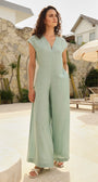 Lincoln Paris Mintleaf cotton linen jumpsuit with wide legs and adjustable straps, displayed on a hanger against a white background.