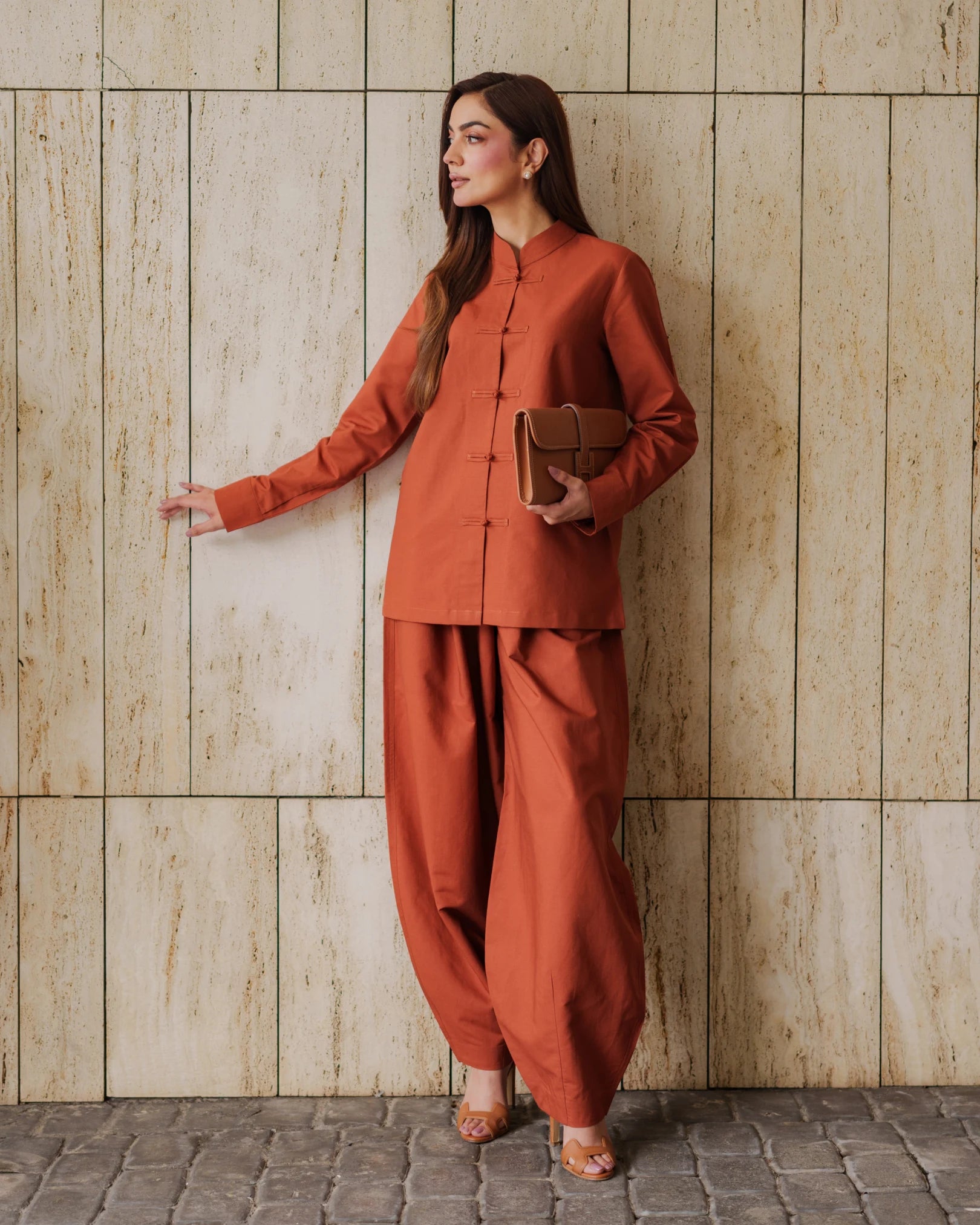 Lincoln Paris Terra Mandarin Co-ord Set featuring matching top and pants in vibrant orange fabric.