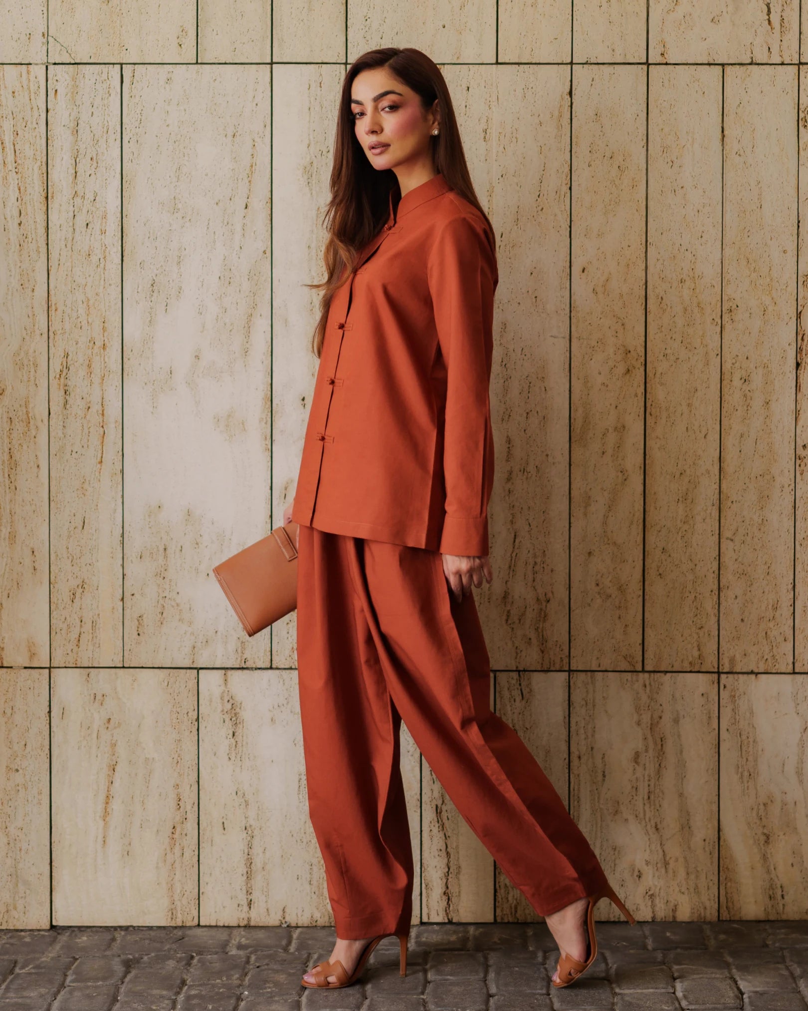 Lincoln Paris Terra Mandarin co-ord set featuring a matching top and pants in vibrant orange fabric.