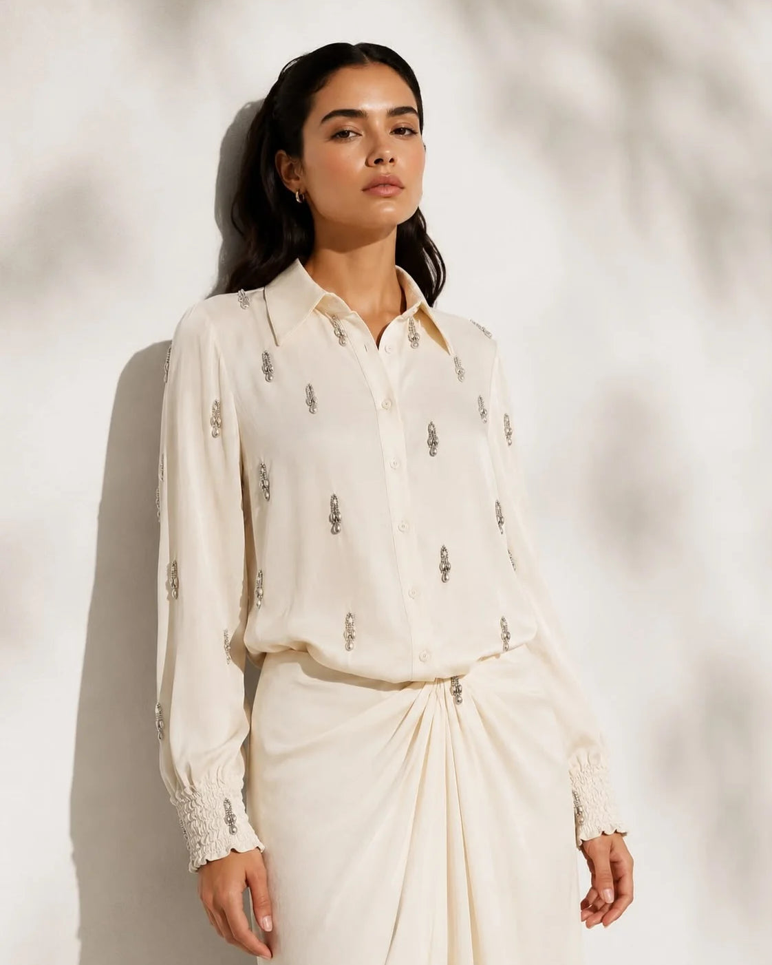 Noore satin skirt set by Lincoln Paris displayed on a mannequin, featuring a flowy satin skirt and matching top.