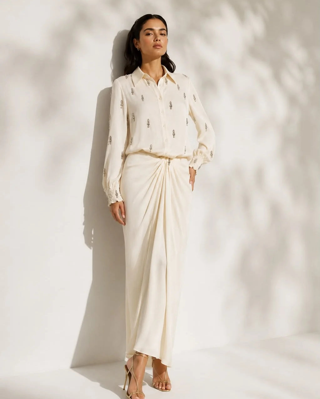 Lincoln Paris Noore satin skirt set featuring a stylish satin skirt and matching top displayed on a hanger.