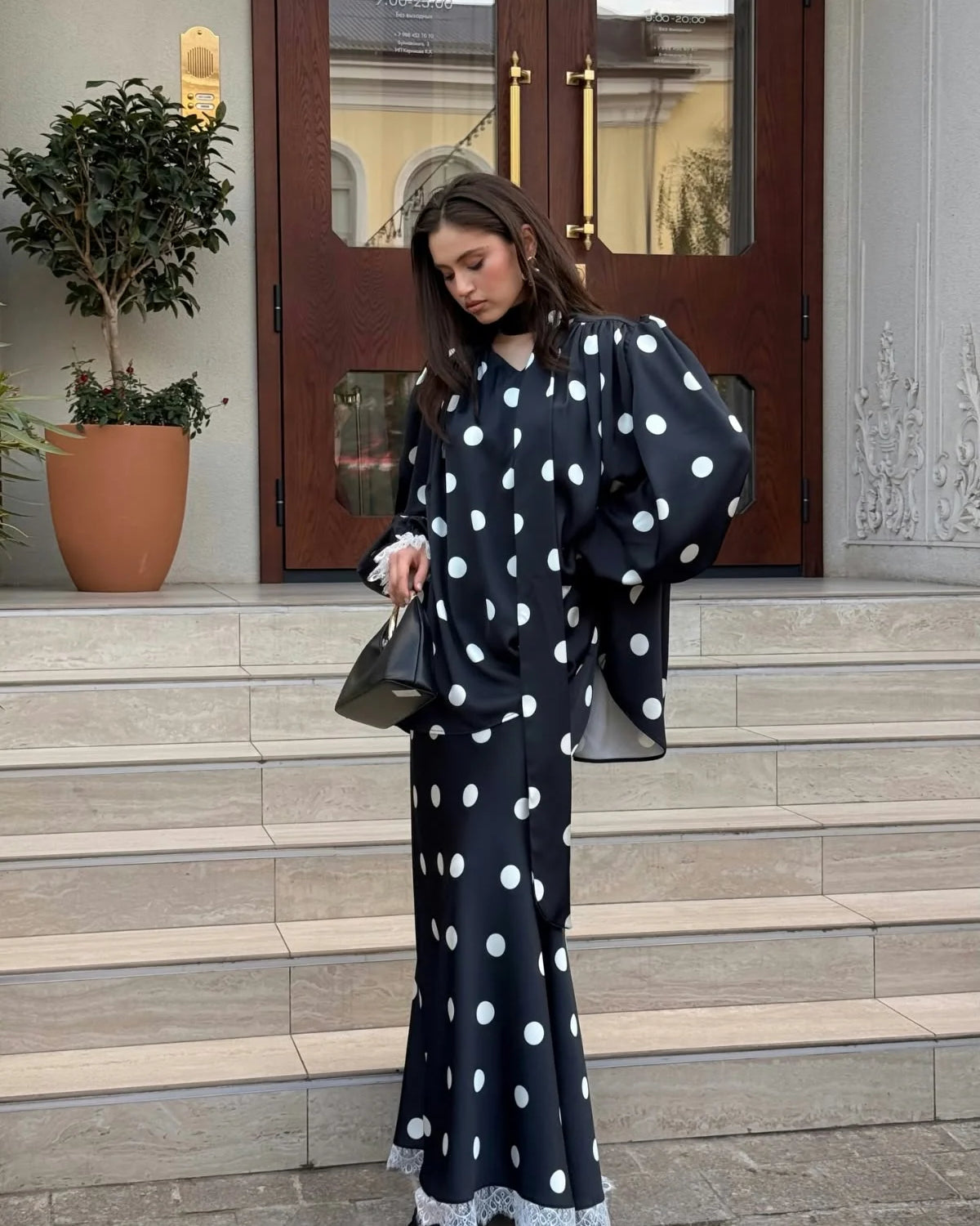 Lincoln Paris Dot & Dori co-ord set featuring a polka dot top and matching skirt, styled for a chic, coordinated look.