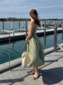 Lincoln Paris Sage Linen Dress featuring a flowy, lightweight linen fabric with a relaxed fit and elegant neckline.