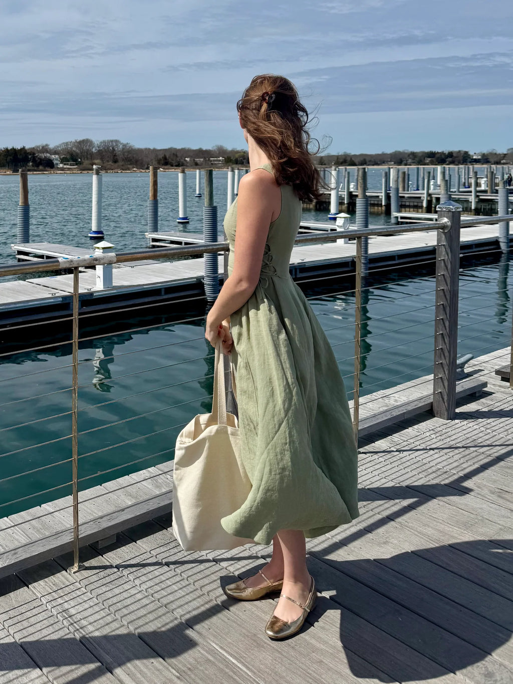 Lincoln Paris Sage Linen Dress featuring a flowy, lightweight linen fabric with a relaxed fit and elegant neckline.