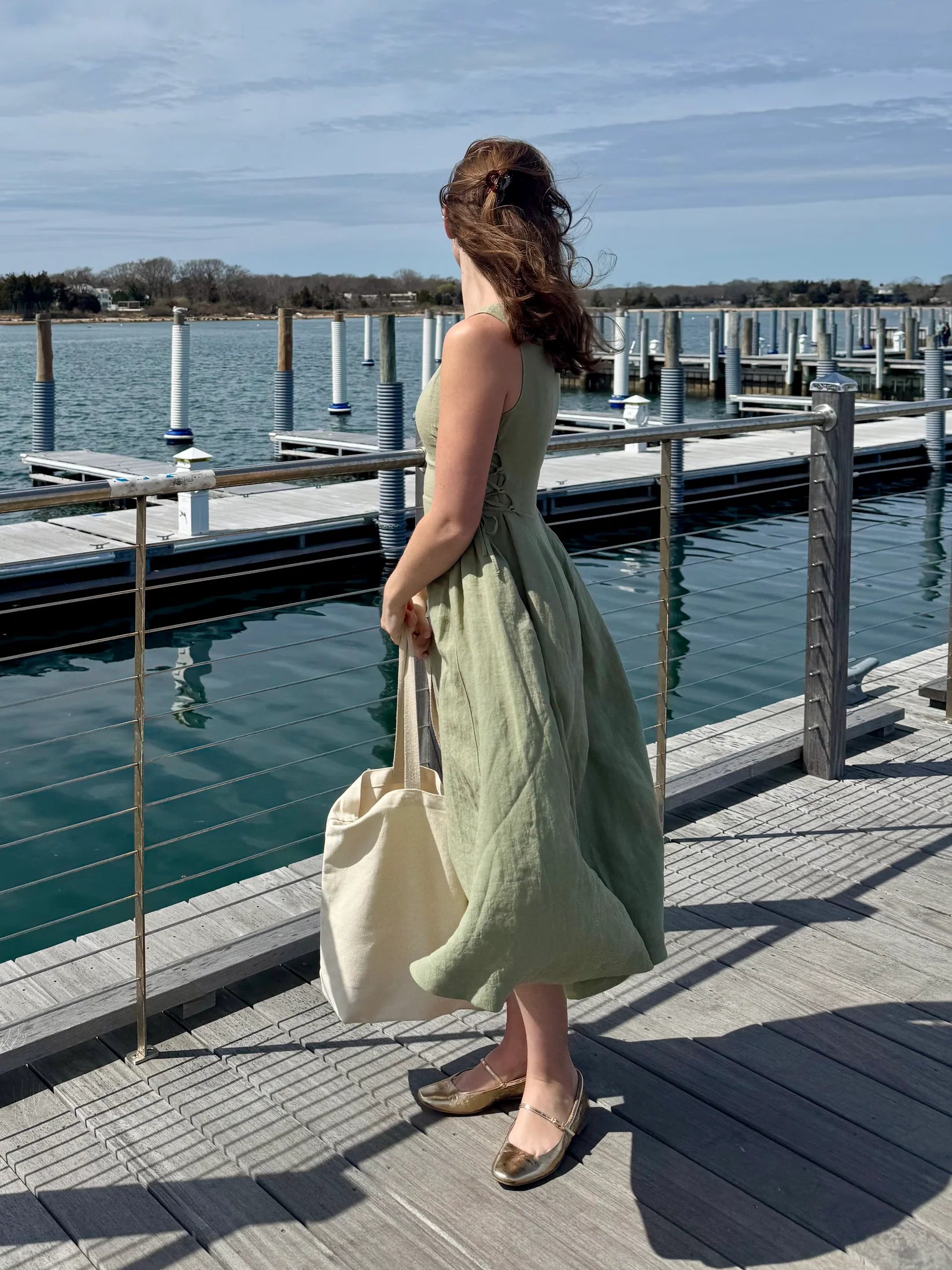 Lincoln Paris Sage Linen Dress featuring a flowy, lightweight linen fabric with a relaxed fit and elegant neckline.