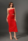 Woman wearing a fitted red ruched midi dress with thin straps and clear high heels